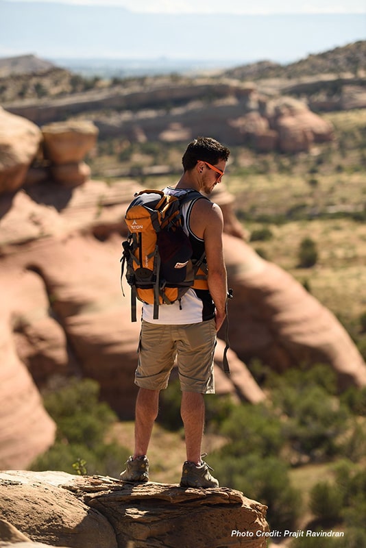 Teton Sports Canyon 2100 Backpack Review — Canyoneer Standing on the Edge of a Cliff.