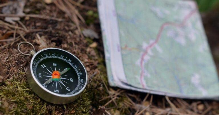 Best Compass for Hiking — Compass and Paper Map in Forest.