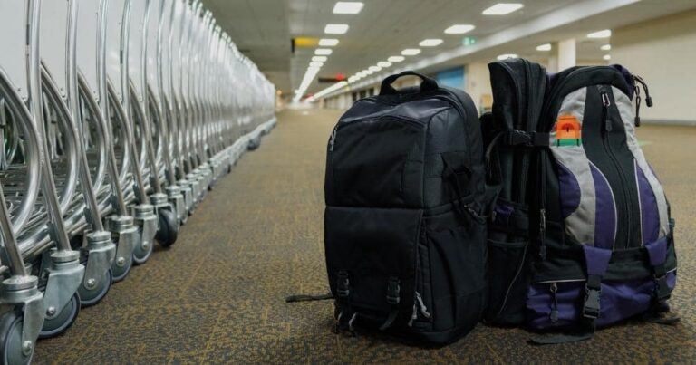 Hiking Backpack Carry-On — Backpack Luggage and Cart at Airport Terminal.