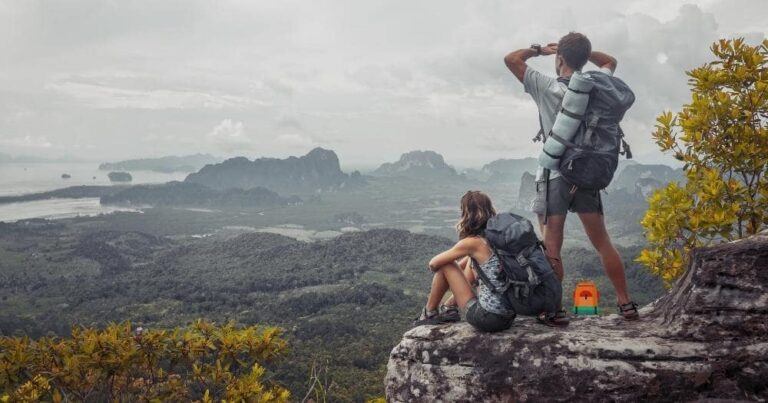 Hiking Backpack Recommendations — Two Tourists with Backpacks Enjoying the View of the Valley.