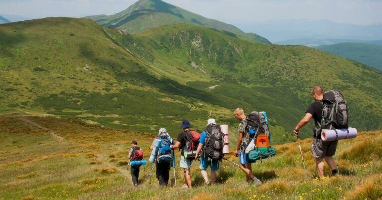 Hiking Backpack Tips — Hikers Going Down a Mountain.