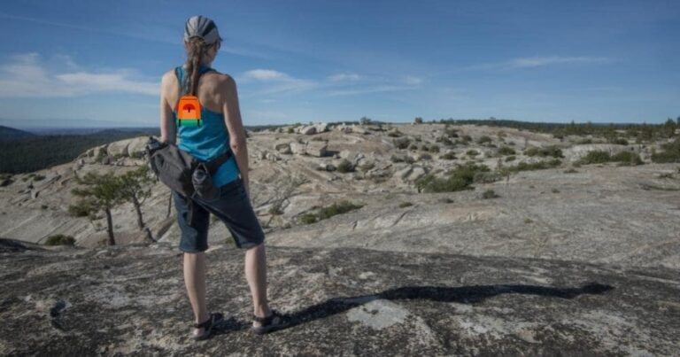 North Face Fanny Pack Review — Woman Hiker Admiring the Rocky Landscape.