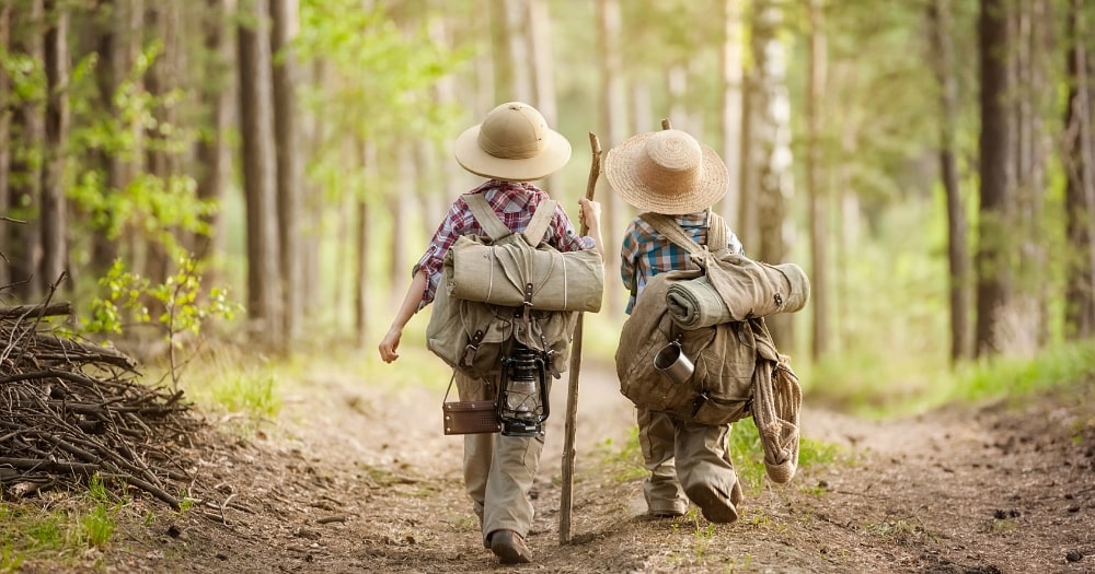 Backpack Rain Cover — Two Boys on a Forest Road with Backpacks.